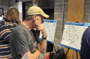 A man looks over a map of I-70.