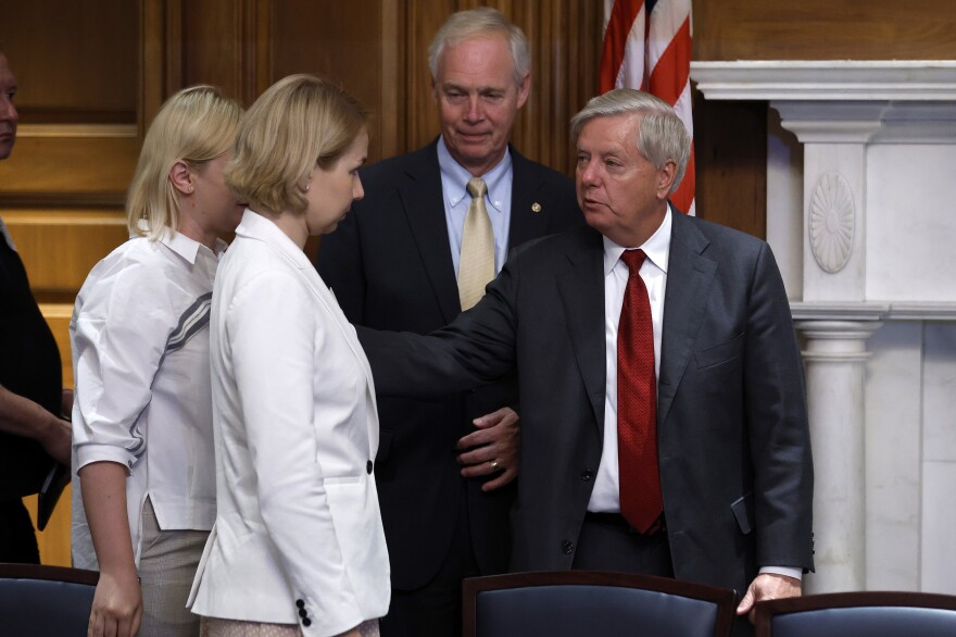 Ukrainian parliament members Yevheniia Kravchuk and Anastasiia Radina, from left, meet with Wisconsin Republican Sen. Ron Johnson and Republican Sen. Lindsey Graham of South Carolina before a meeting at the U.S. Capitol in Washington in June.