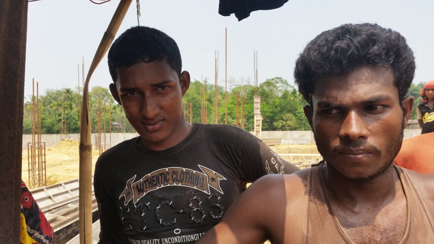 Habibur Rahaman (left) and Alauddin are Bangladeshi construction workers who worry that the influx of Rohingya refugees will make it harder to find a job. They say Rohingya are willing to work for half the wages that Bangladeshis get.