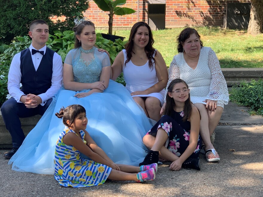 (From left to right) Gunner Schmidt, Adelle Pineda, Carmin Daugherty, Blanca Plascencia, Natalia Daugherty and Elia Nuñez pose for Carmin's quinceañera photos outside Central College in Pella, Iowa on Saturday, Aug. 15, 2020. Carmin's two sisters Adelle and Natalia helped the photographer along with Carmin's mom Plascencia and grandmother Nuñez.