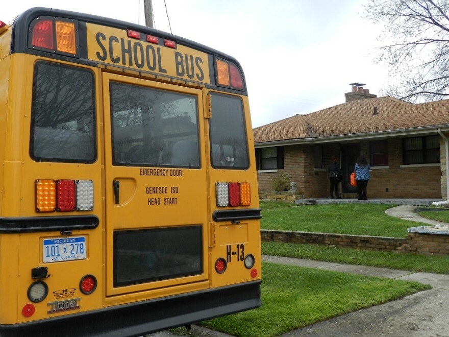 Teachers and volunteers canvas house to house recruiting children for early education programs, which may help offset damage from the lead-contaminated water.