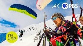 Two people speed riding in the snowy mountains