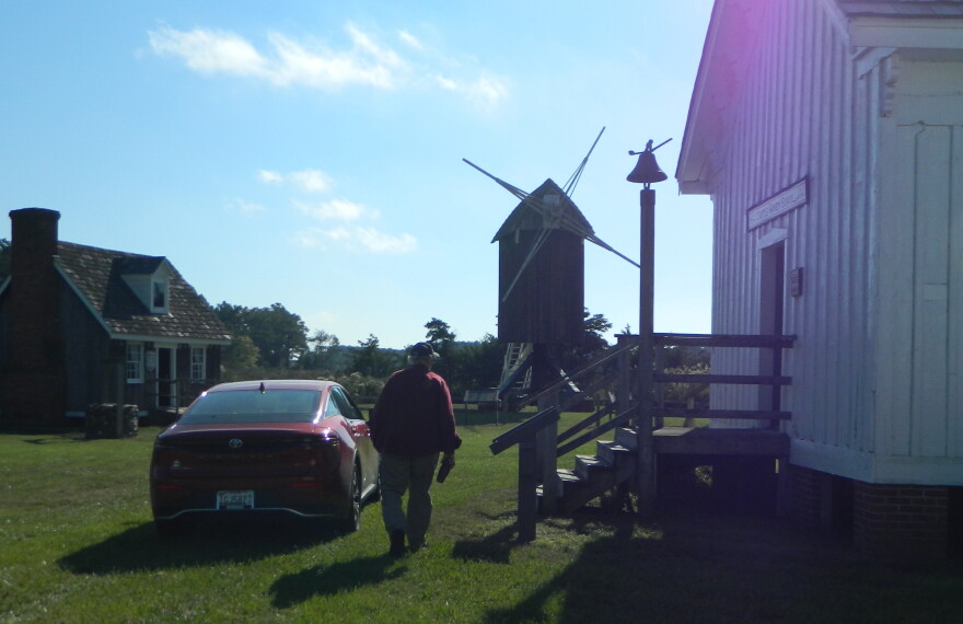 George Radcliffe walks toward the windmill on the Spocott property.