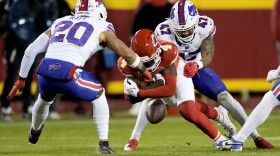 Kansas City Chiefs wide receiver Rashee Rice (4) fumbles as Buffalo Bills safety Taylor Rapp (20) and cornerback Christian Benford (47) defend during the second half of an NFL football game Sunday, Dec. 10, 2023, in Kansas City, Mo. (AP Photo/Charlie Riedel)