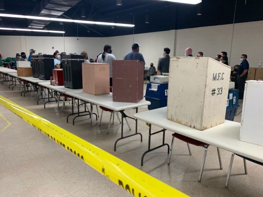 Election workers in Window Rock, Ariz., conduct a recount of ballots from the Navajo Nation's Central Agency from the tribe's 2022 presidential primary election.