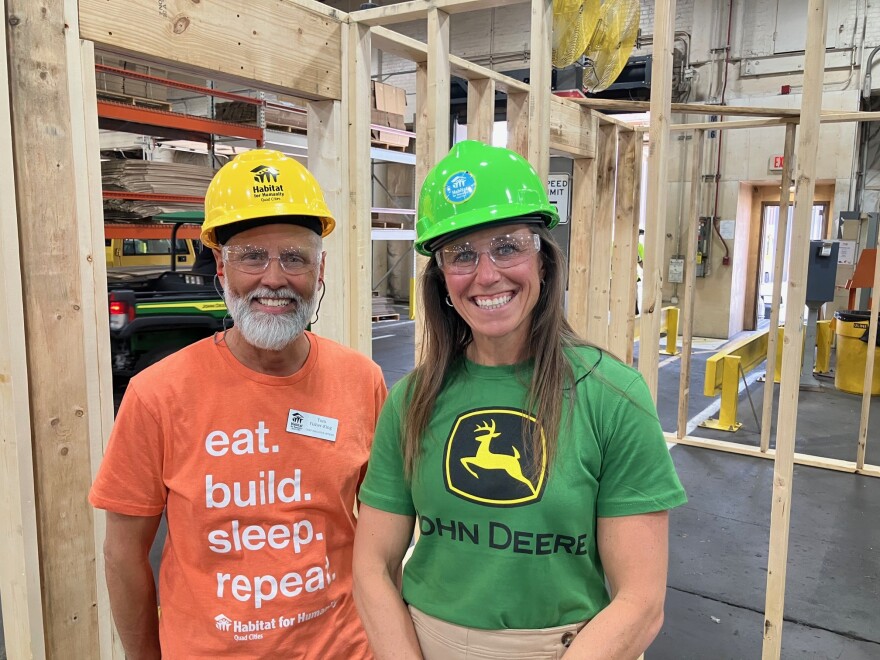 Habitat for Humanity QC executive director Tom Fisher-King with Taryn Edgin, a third-generation John Deere employee, who's been president of the John Deere Foundation for 13 months.
