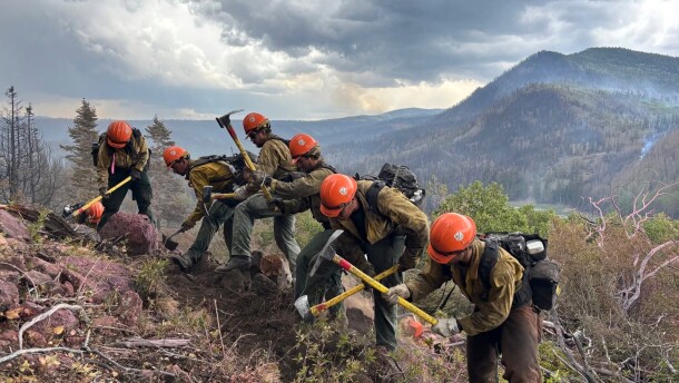 This image provided by the U.S. Forest Service Friday, June 26, 2026, shows firefighters responding to the Cottonwood Fire, June 24, 2026, above Birch Lake, near Beaver, Utah.