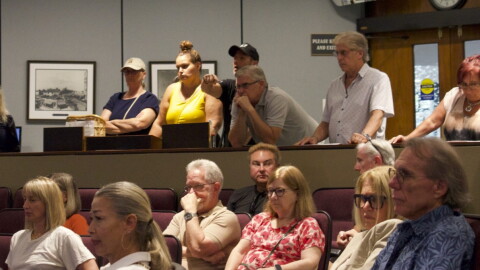 Nicholas DiIelsi, owner of Cafe Amici, yells from the gallery at Sarasota parking staff during Monday's parking open house.
