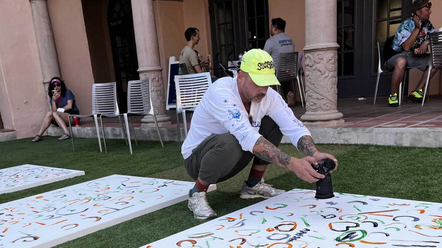 A man takes individual photos of each mark on Oct. 17, 2026. 