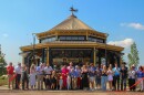 Governor Mike DeWine and his wife, Fran, center, cut a ribbon to open the new carousel at the Ohio State Fairgrounds, July 25, 2026.