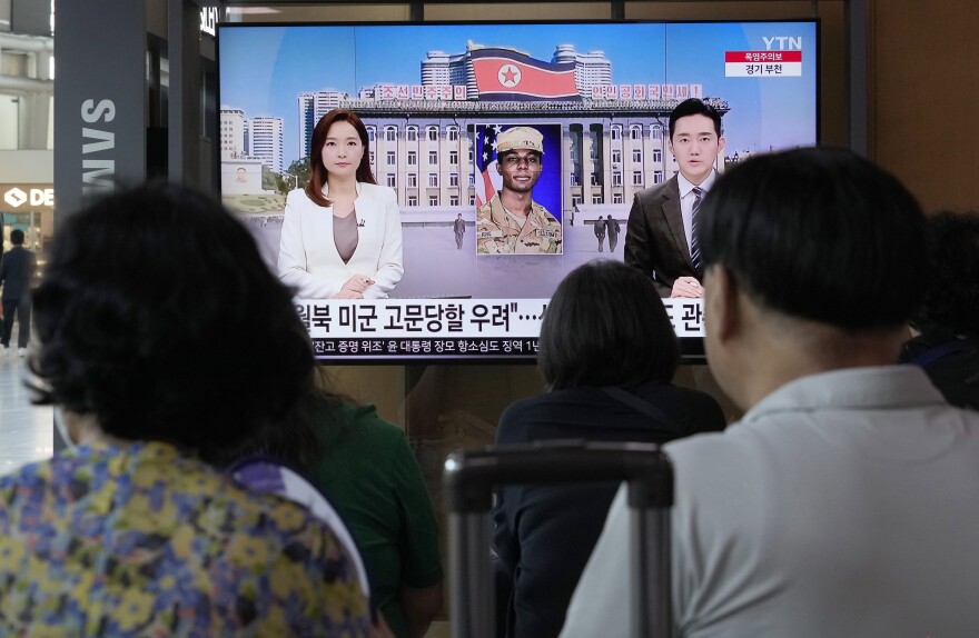 A TV screen shows a file image of American soldier Travis King during a news program at the Seoul Railway Station in Seoul, South Korea, on Saturday.