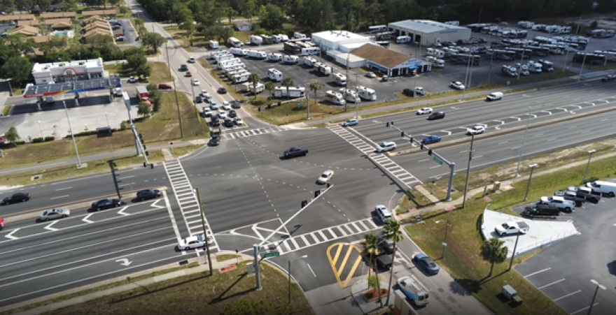 Four Way intersection with a top-down view, with a few businesses on the corners 