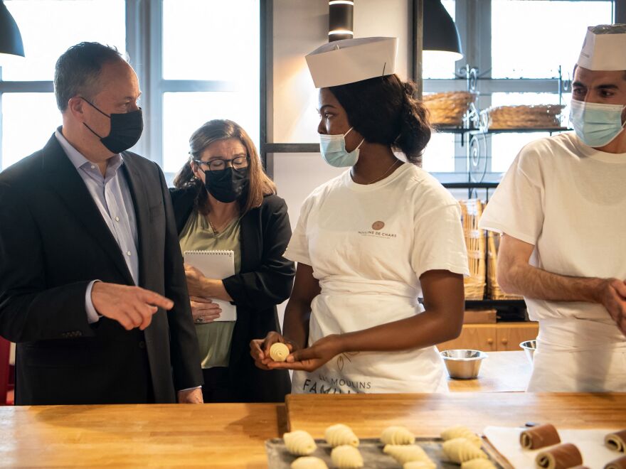 Second gentleman Doug Emhoff meets with interns during a visit to a culinary school in Paris on Nov. 12.