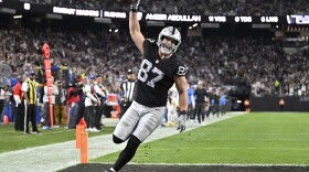Las Vegas Raiders tight end Michael Mayer (87) celebrates after scoring a touchdown against the Los Angeles Chargers during the first half of an NFL football game, Thursday, Dec. 14, 2023, in Las Vegas. (AP Photo/David Becker)