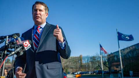 Congressman Seth Moulton speaks to the news media and describes what he witnessed during his visit at to the ICE Boston Field Office in Burlington. (Jesse Costa/WBUR)