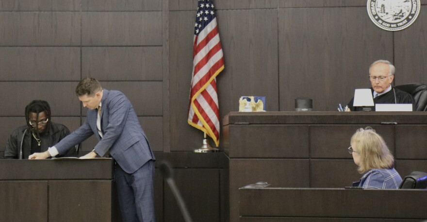 Assistant State Attorney Ryan Nagel shows evidence to Ian “Bob” Munnerlyn during his testimony Wednesday, Sept. 23, 2026. Munnerlyn and his girlfriend, Christin Cassels, lived together at the time of her 2017 killing. (Katie Klaiber/WUFT News)