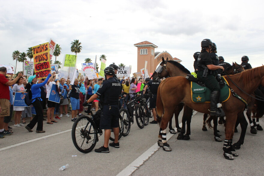 Law enforcement officers on bicycles and horses kept protesters and supporters separated.