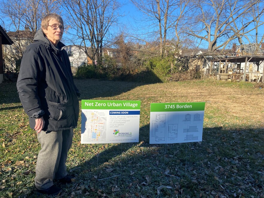 Executive Director of Working in Neighborhoods (WIN) Sister Barbara Busch stands on one of the vacant lots where the nonprofit will build a net zero home.