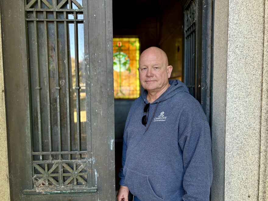 Some people might be scared of old mausoleums, but not Charlotte city sexton Bill Biddy. He exits a family tomb in Elmwood Cemetery without a sweat.