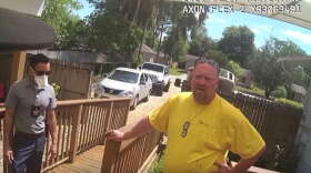 Christopher Canfora, shown in this image from body cam video, spoke with a sheriff's deputy and detective at  his home in DeBary on Tuesday afternoon. 