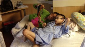 Kathy Liu and her son Joey Xu talk to friends back home in Gainesville, Fla., from his hospital room in Cincinnati.