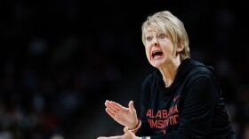 Woman shouts at a team 