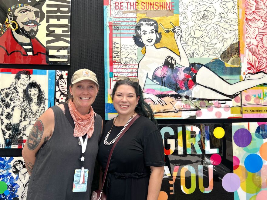 Artist Sarah Collier (left) and collector Serena Tibbitt pose inside Collier’s tent at the Coconut Grove Arts Festival.