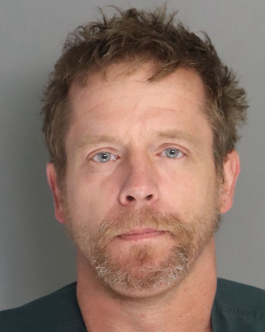 This May 30, 2026, booking photo from the Aiken County (S.C.) Sheriff's Department shows Johnathan Willard, 39, who is charged with kidnapping and impersonating a law enforcement officer in connection with a dramatic incident caught on a trucker's dashboard camera. (Aiken County Sheriff via AP)