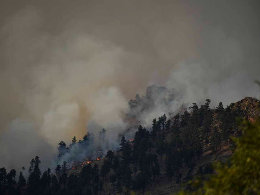 The Calwood Fire burns on a hillside northwest of Boulder on Oct. 17, 2020.