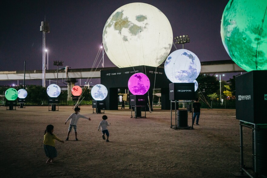 A day before the Chuseok holiday, children run around artificial full moons, part of an installation at a park in eastern Seoul. Koreans believe that wishes made to the full moon on Chuseok will come true. The Seongdong District Office teamed up with local businesses to install the moons as a way to convey hope in the time of COVID-19.