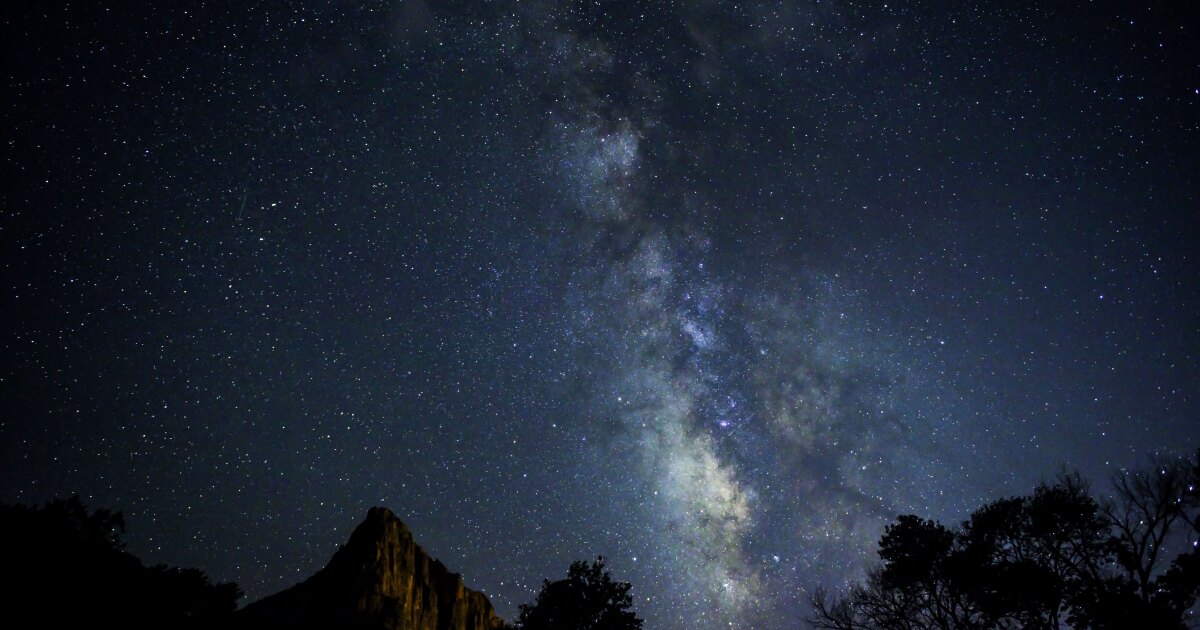 The Milky Way is visible over The Watchman summit in Utah's Zion National Park