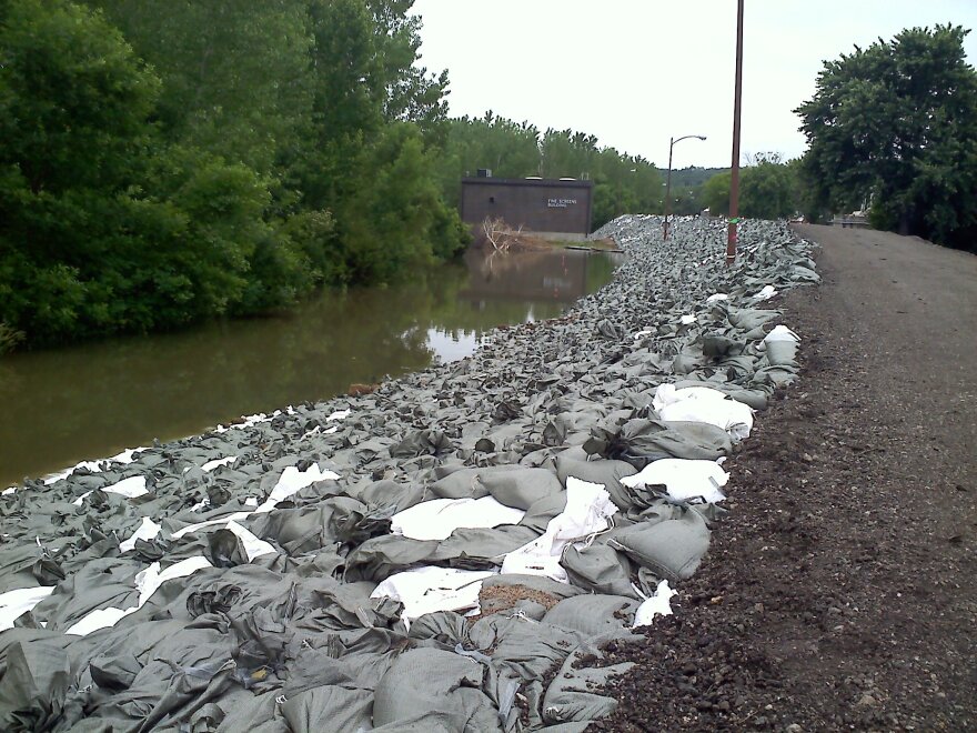 Sandbags sit atop an earthen berm protecting Omaha's Waste Water Treatment Plant.