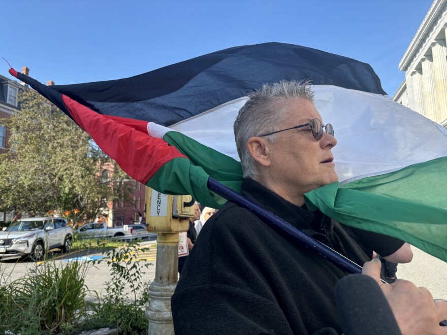 Liz Seaton singing a song for peace and Palestine outside the Cumberland County Courthouse in support of protesters being arraigned on July 24, 2025.
