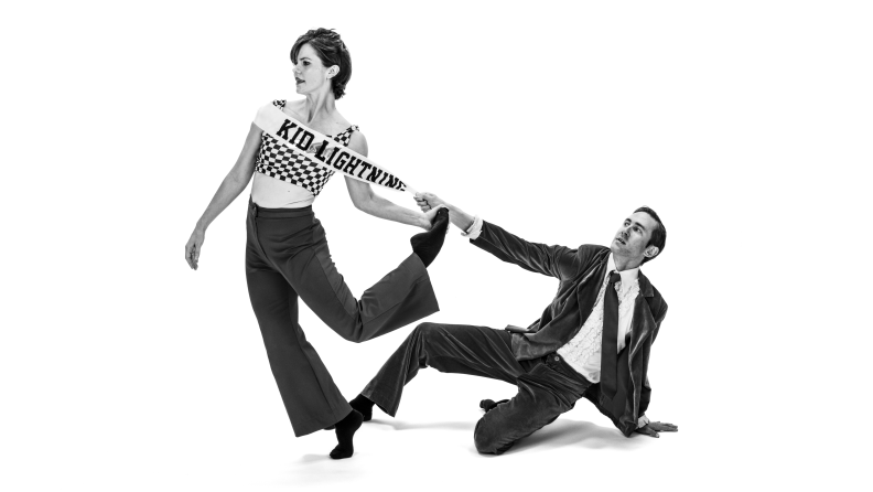 A black and white photo of a man and a woman. 