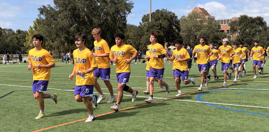 The Pi Lambda Phi team walks onto the field before the beginning of the Nose Bowl game on Sunday, Oct.18, 2026. (Madison Middleton/WUFT News)