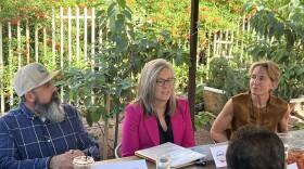 Arizona Gov. Katie Hobbs, center, speaks with ag leaders, left to right, Jonathan Dinsmore of Dinsmore Farms, Jesus Tovar, president of