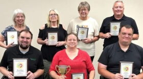 Maryville Forum employees holding 2026 Missouri Press Association awards (back row L-R) reporter Kathryn Rice, advertising manager Rita Piveral, advertising representative Twyla Martin and owner/publisher Phil Cobb and (front row L-R) news editor Geoffrey Woehlk, former managing editor Skye Pournazari and current managing editor Jon Dykstra.