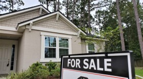 exterior of house with For Sale sign