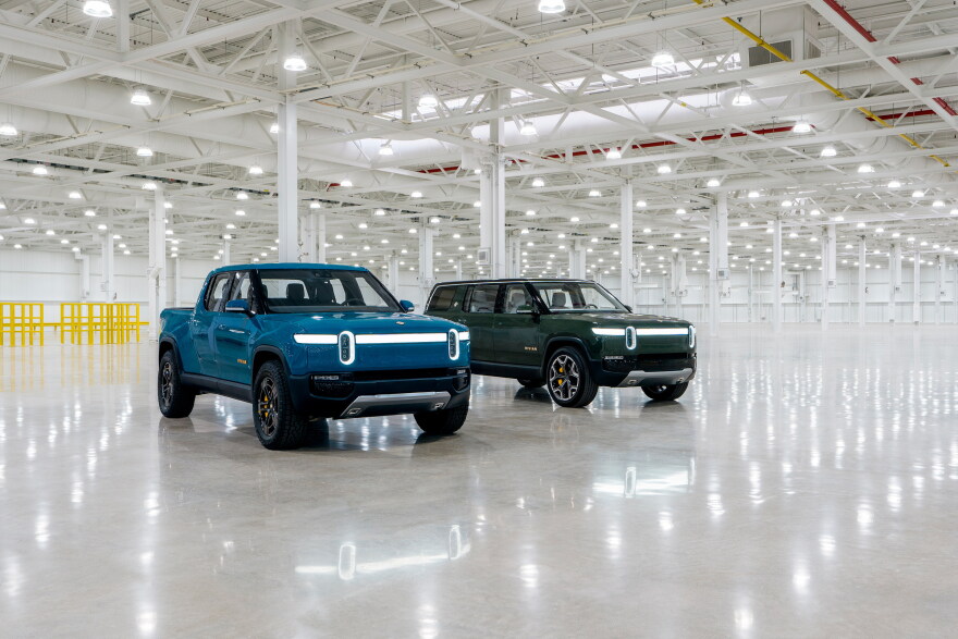 Rivian's R1T pickup and R1S sport utility vehicle inside the Normal manufacturing plant.