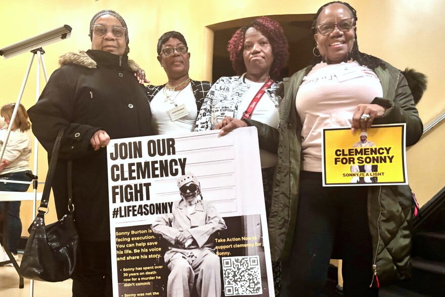Eddie Mae Ellison, Jackie Bradford, Mary Bradford and Lois Harris hold signs urging Alabama Gov. Kay Ivey to grant clemency for their family member Charles “Sonny” Burton, Jan. 28, 2026 in Montgomery, Ala. (AP Photo/Kim Chandler)