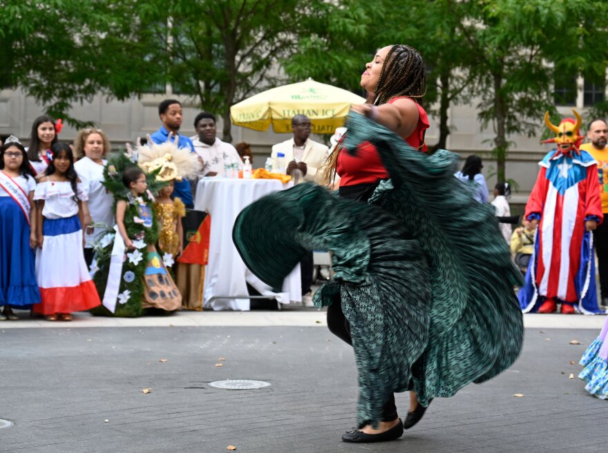 Brendaliz Cepeda, dancer and singer for the band Bomba de Aqui, dances for the crowd at the Caribbean American Heritage Festival.