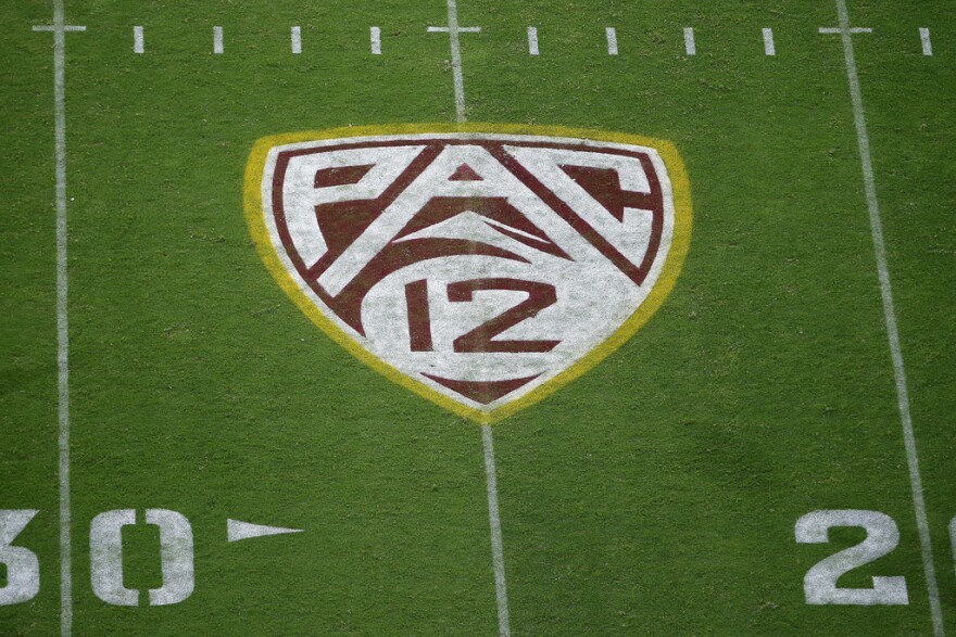 The Pac-12 logo is shown at Sun Devil Stadium during the second half of an NCAA college football game between Arizona State and Kent State in Tempe, Ariz., Aug. 29, 2019. Colorado is leaving the Pac-12 to return to the conference the Buffaloes jilted a dozen years ago, and the Big 12 celebrated the reunion with a two-word statement released through Commissioner Brett Yomark: “They’re back.”