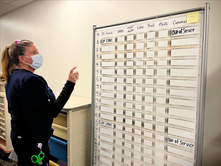 Dona Thomas, an ER nurse, and her colleagues came up with a makeshift system –– involving a white board and dry erase markers –– to keep track of patient care in the months following a cyberattack in 2021. Two years later, the white board and other tools they used during the cyberattack are stored in a backroom –– in case another attack takes place.