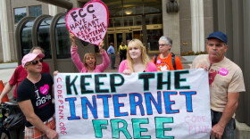 Protesters hold a rally to support net neutrality at the Federal Communications Commission building in Washington, D.C.