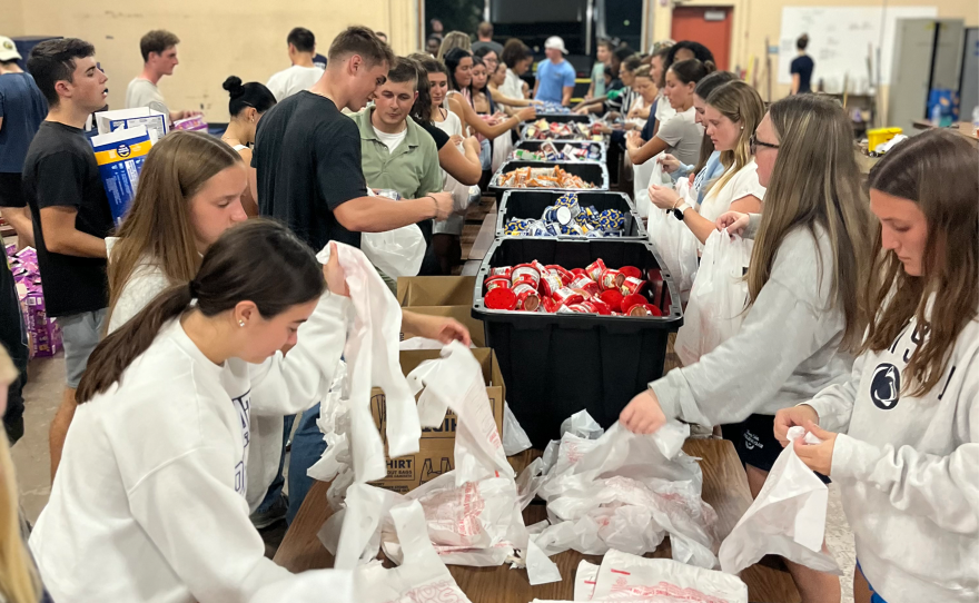 In this photo, volunteers with the Moshannon Valley YMCA help sort food. It's one of many organizations preparing for an influx of people in need of food assistance in light of frozen SNAP benefits.