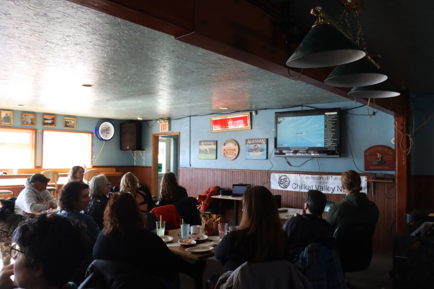 Haines locals watch the livestream of the Freeride World Tour from a local bar and restaurant.