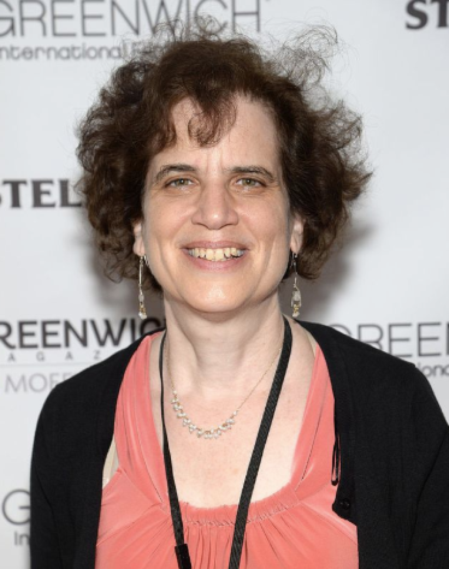 A headshot of a woman in front of a film festival background