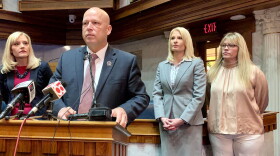 Sen. Mike Crider (R-Greenfield) talks about his legislation with Sen. Erin Houchin (R-Salem), left, and sexual assault prevention advocates supporting him.