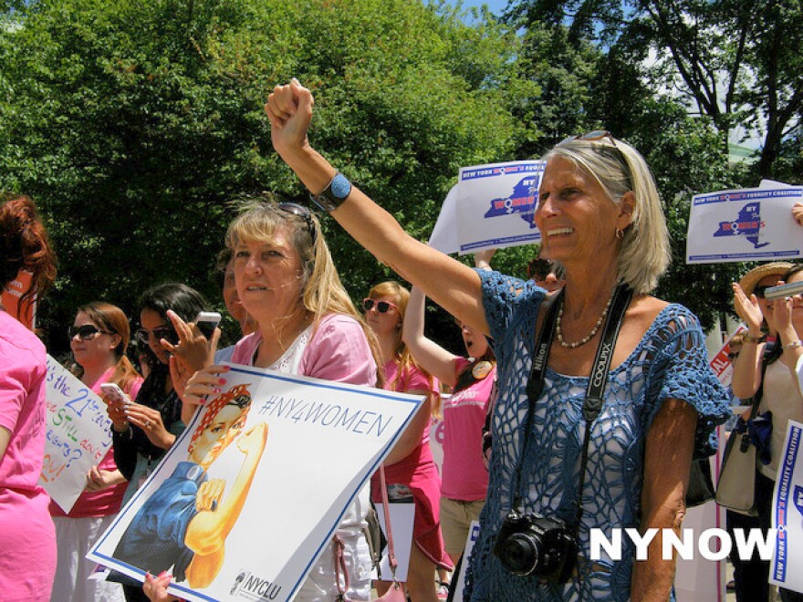 Women rally for equality act at the Capitol in early June