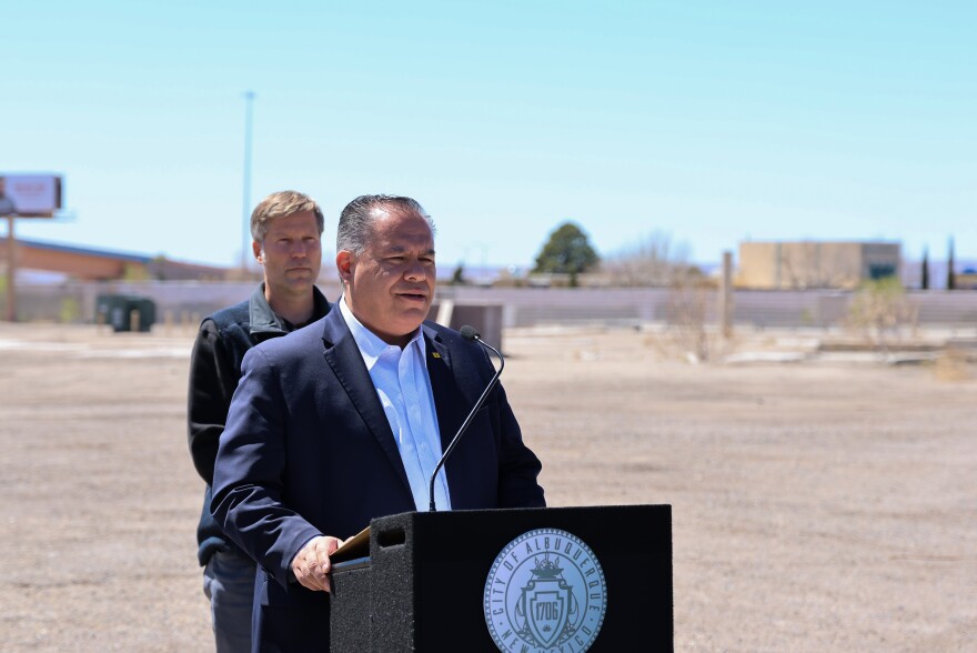 Albuquerque Mayor Tim Keller (left) looks on as Senator Michael Padilla addresses the media